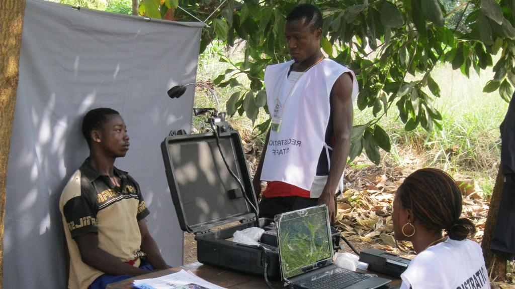 Registration staff operate a booth outside
